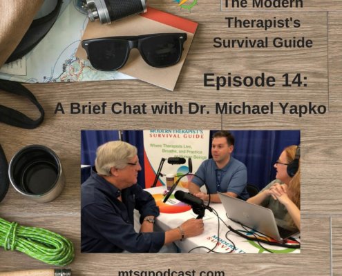 Photo ID: a wooden tabletop with a map, sunglasses, a camera, a thermos, some paracord, and a leather and canvas bag with a picture of Curt and Katie chatting with Dr. Yapko at The Evolution of Psychotherapy Conference with text overlay "Episode 14: A Brief Chat with Dr. Michael Yapko"