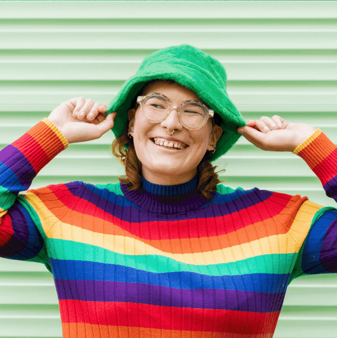 Photo ID: Picture of Sonny Jane Wise wearing a rainbow top and a green hat